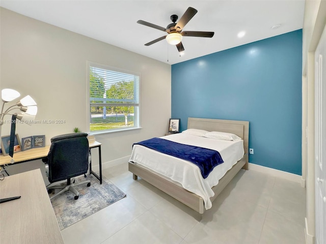 bedroom with light tile patterned floors and ceiling fan