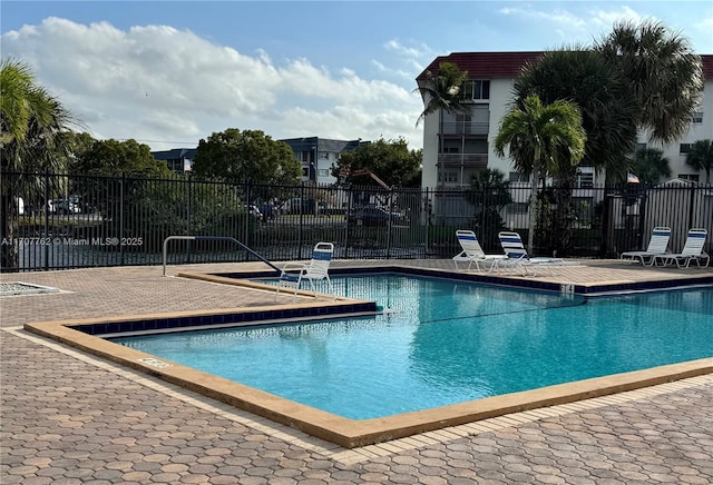 view of swimming pool with a patio