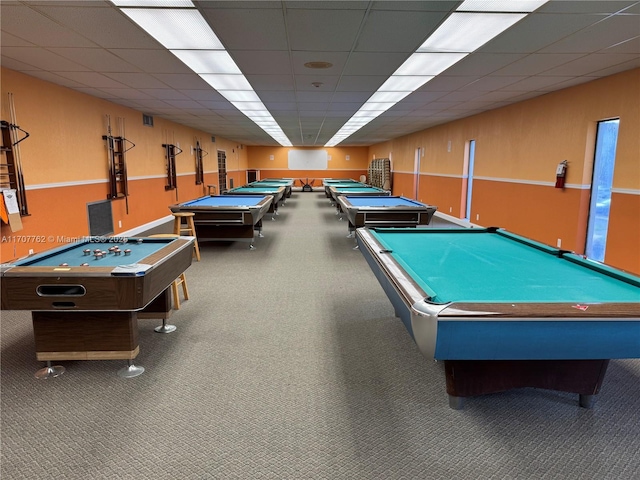 recreation room with a drop ceiling, pool table, and carpet flooring