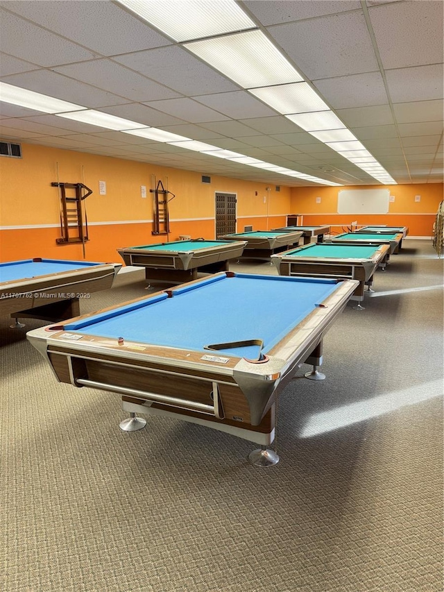 recreation room with a paneled ceiling, pool table, and carpet flooring