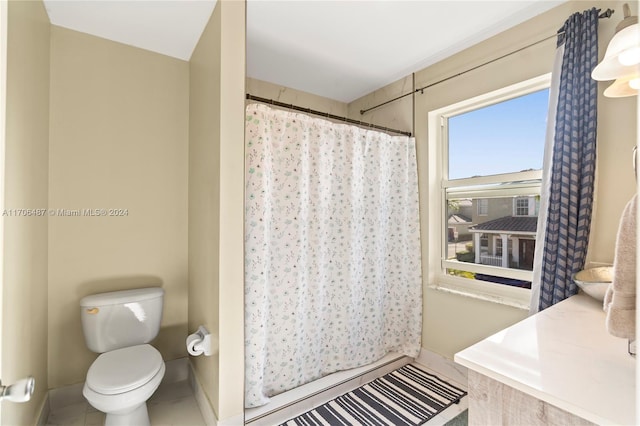 bathroom featuring tile patterned floors, walk in shower, and toilet