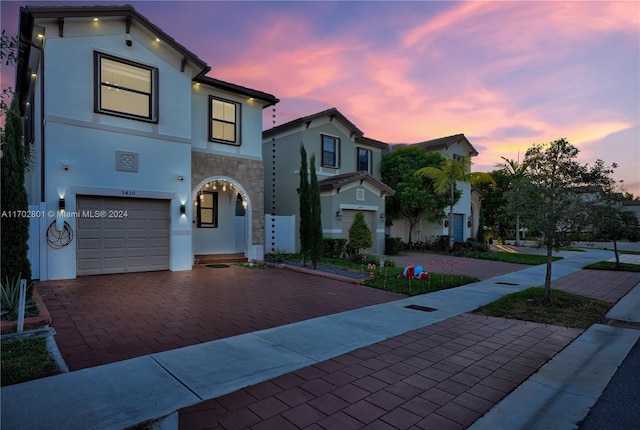 mediterranean / spanish house with a garage