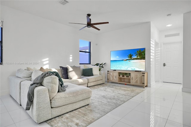 tiled living room featuring ceiling fan