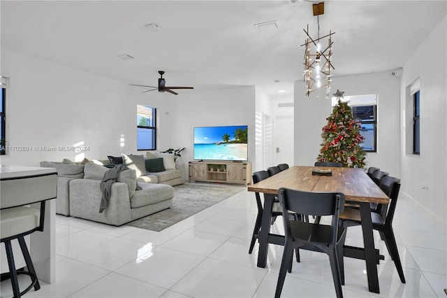 dining area featuring ceiling fan and light tile patterned floors