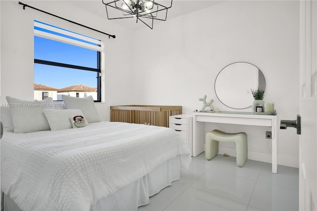 bedroom with light tile patterned flooring and a notable chandelier