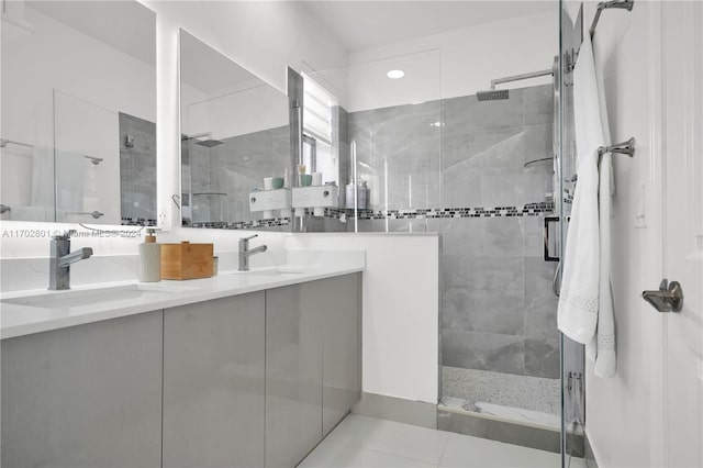 bathroom featuring vanity, tile patterned floors, and an enclosed shower