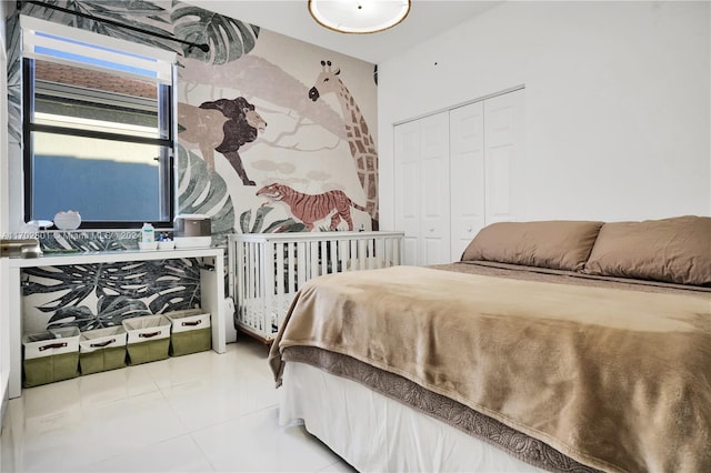 bedroom featuring tile patterned flooring and a closet