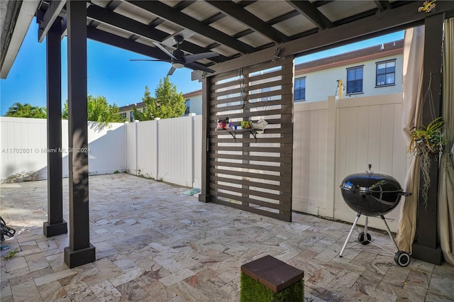 view of patio / terrace featuring area for grilling and ceiling fan