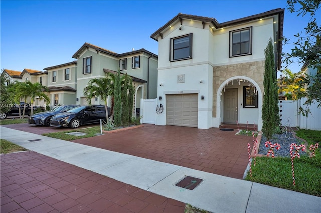 mediterranean / spanish house featuring a garage