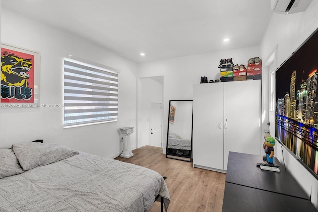 bedroom with light wood-type flooring