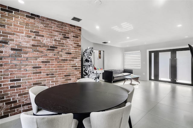 dining room with brick wall