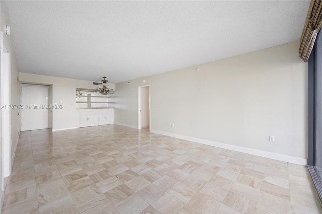 interior space featuring a textured ceiling