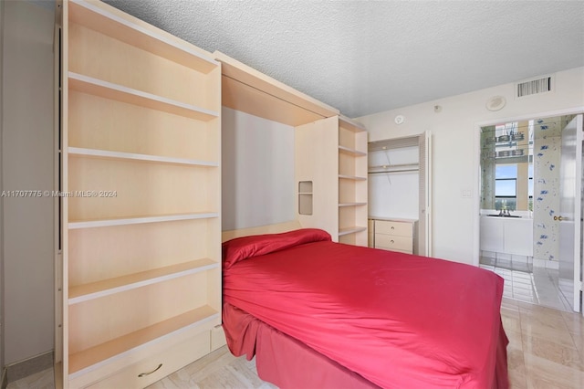 bedroom with a textured ceiling