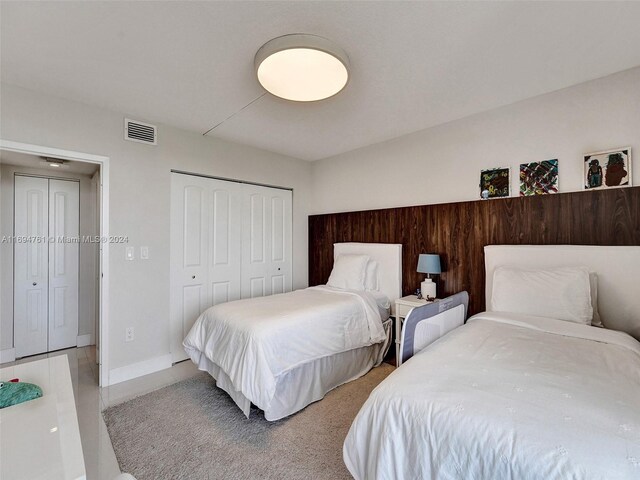 carpeted bedroom featuring a closet