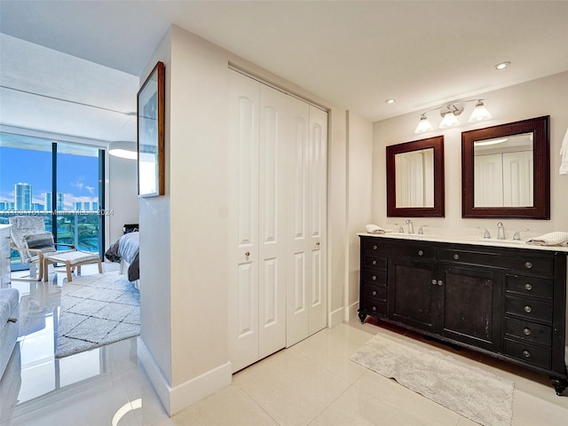 bathroom with tile patterned flooring and vanity