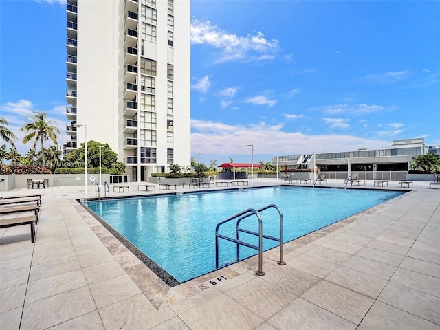 view of pool featuring a patio