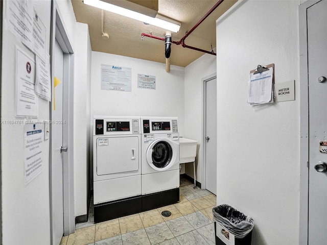 laundry area with washer and clothes dryer