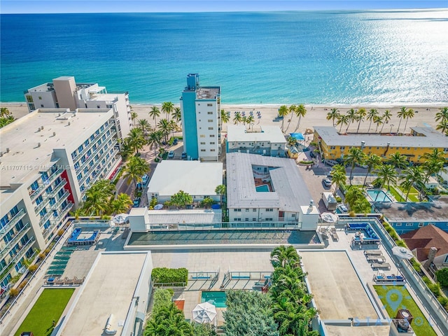 bird's eye view with a water view and a view of the beach