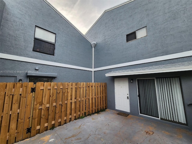 entrance to property with a patio area