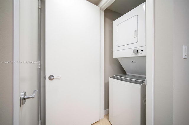 laundry area featuring stacked washer and clothes dryer