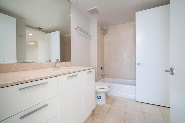 full bathroom with tile patterned floors, vanity, toilet, and tiled shower / bath