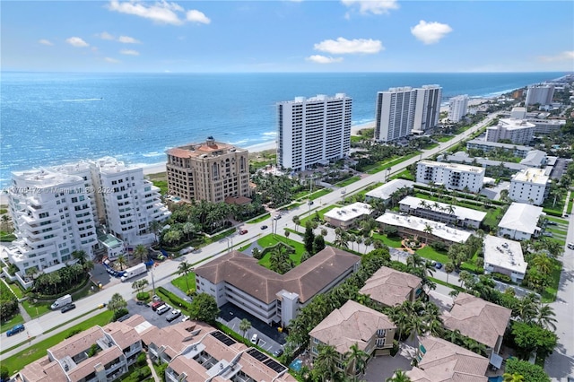 drone / aerial view with a beach view and a water view