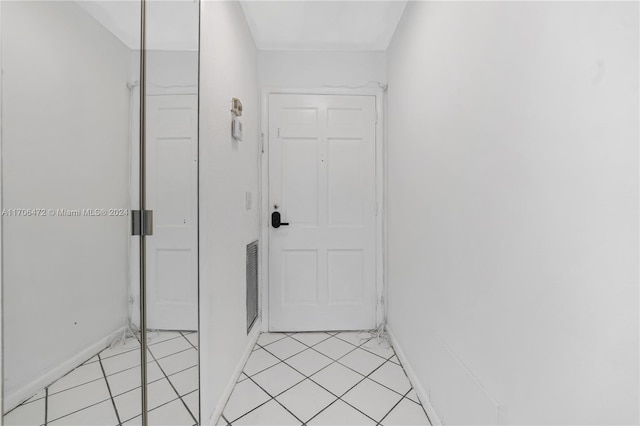 hallway with light tile patterned floors