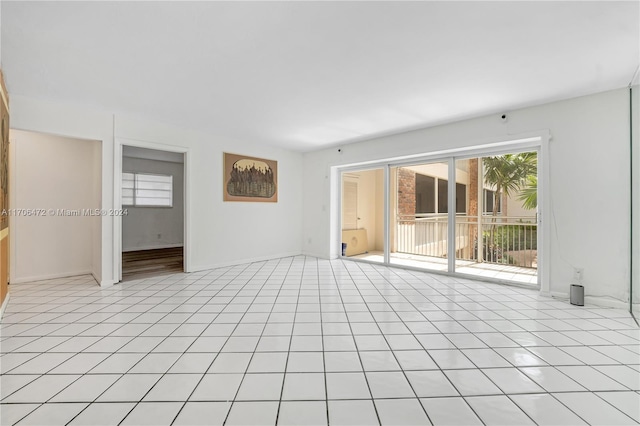 spare room with light tile patterned floors