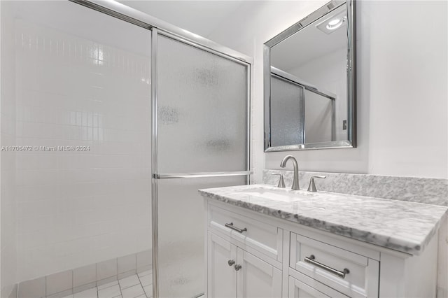 bathroom with vanity and an enclosed shower