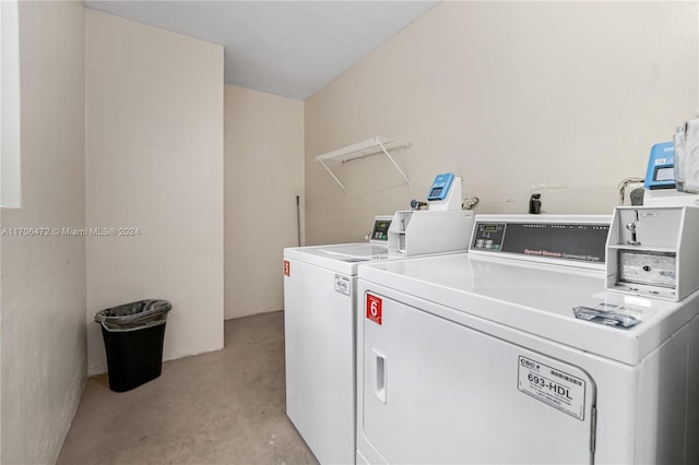 clothes washing area featuring independent washer and dryer