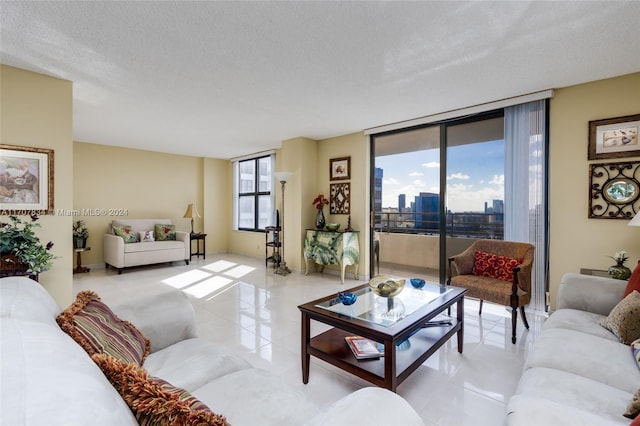 tiled living room with a textured ceiling