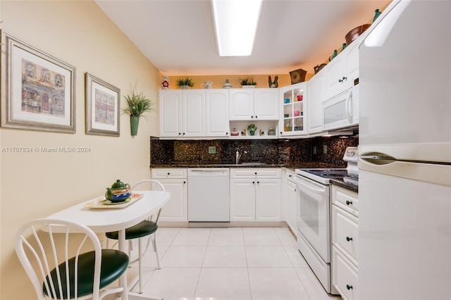 2500 Parkview Dr Unit 2315, Hallandale Beach, FL 33009 - kitchen featuring white appliances, backsplash, white cabinets, and glass insert cabinets