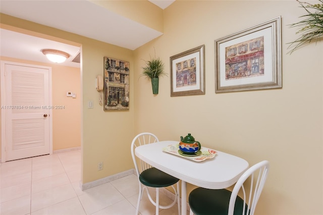 dining area featuring light tile patterned floors