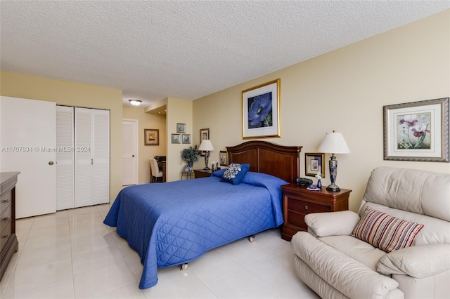 2500 Parkview Dr Unit 2315, Hallandale Beach, FL 33009 - bedroom with a closet, a textured ceiling, and light tile patterned floors