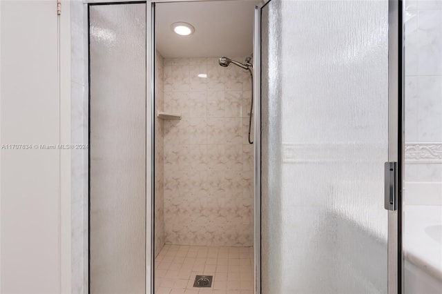 bathroom featuring tile patterned flooring and walk in shower