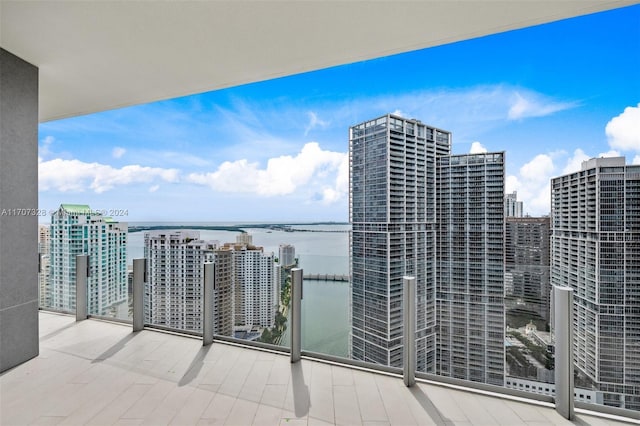 balcony featuring a water view