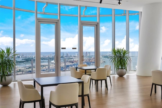 300 Biscayne Blvd Way Unit 3406, Miami, FL 33131 - dining area with a wall of windows, wood finished floors, and a city view