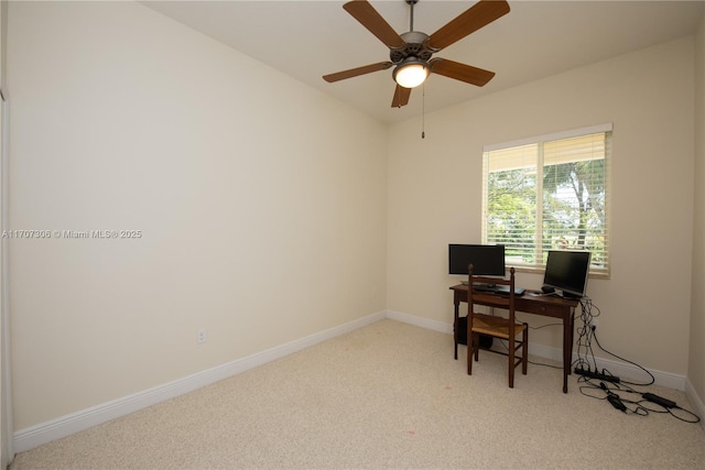 home office featuring light colored carpet and ceiling fan