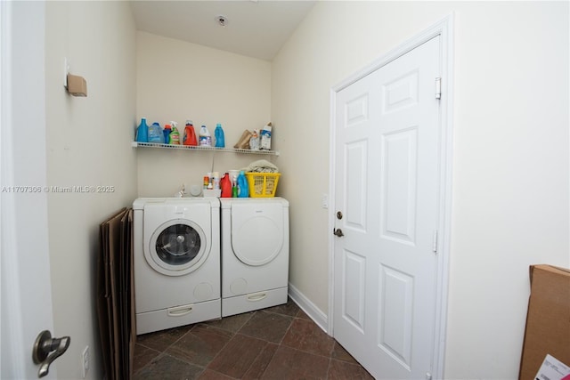 washroom featuring washer and clothes dryer