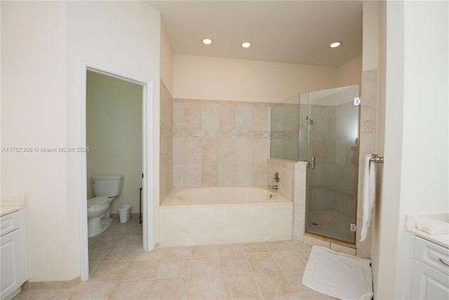 full bathroom featuring vanity, tile patterned flooring, independent shower and bath, and toilet