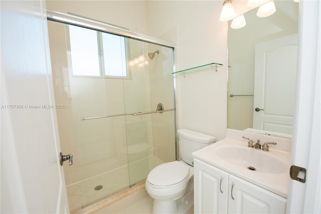 bathroom with vanity, toilet, and walk in shower