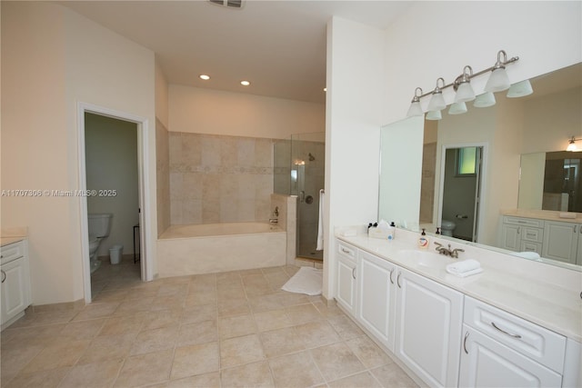 full bathroom featuring vanity, toilet, tile patterned flooring, and plus walk in shower