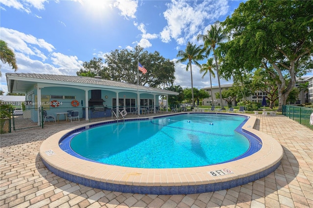 view of swimming pool with a patio area