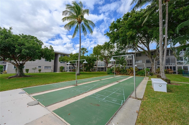 surrounding community featuring a lawn