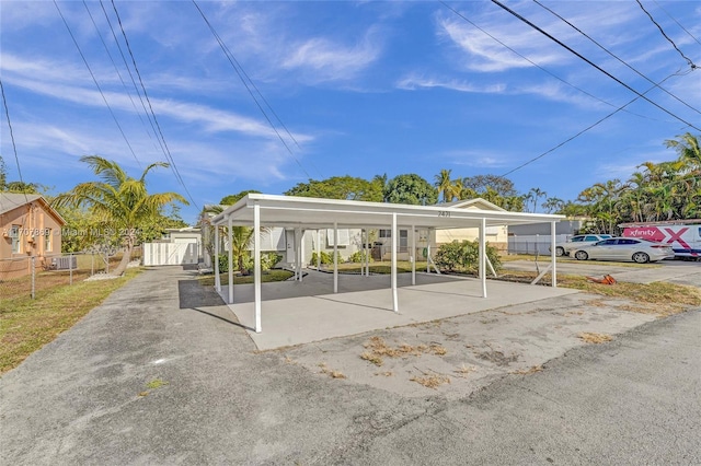 view of parking with a carport