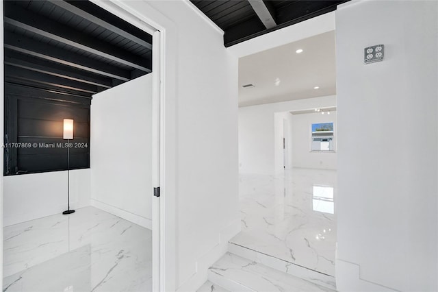 corridor featuring beamed ceiling and wood ceiling