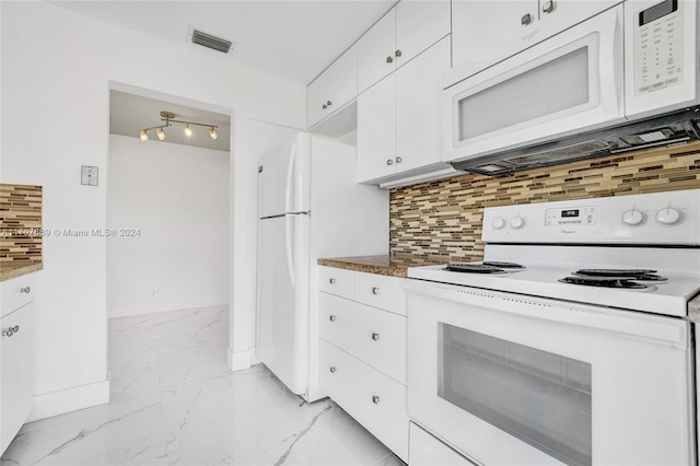 kitchen featuring white appliances, tasteful backsplash, and white cabinetry