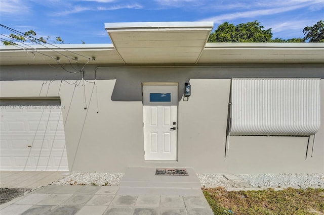 property entrance with a garage