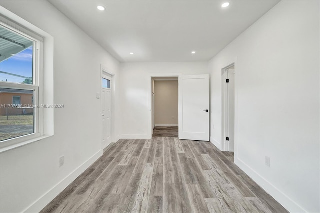 spare room with a healthy amount of sunlight and light wood-type flooring