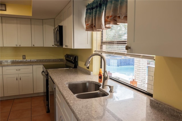 kitchen with white cabinetry, sink, a healthy amount of sunlight, and appliances with stainless steel finishes